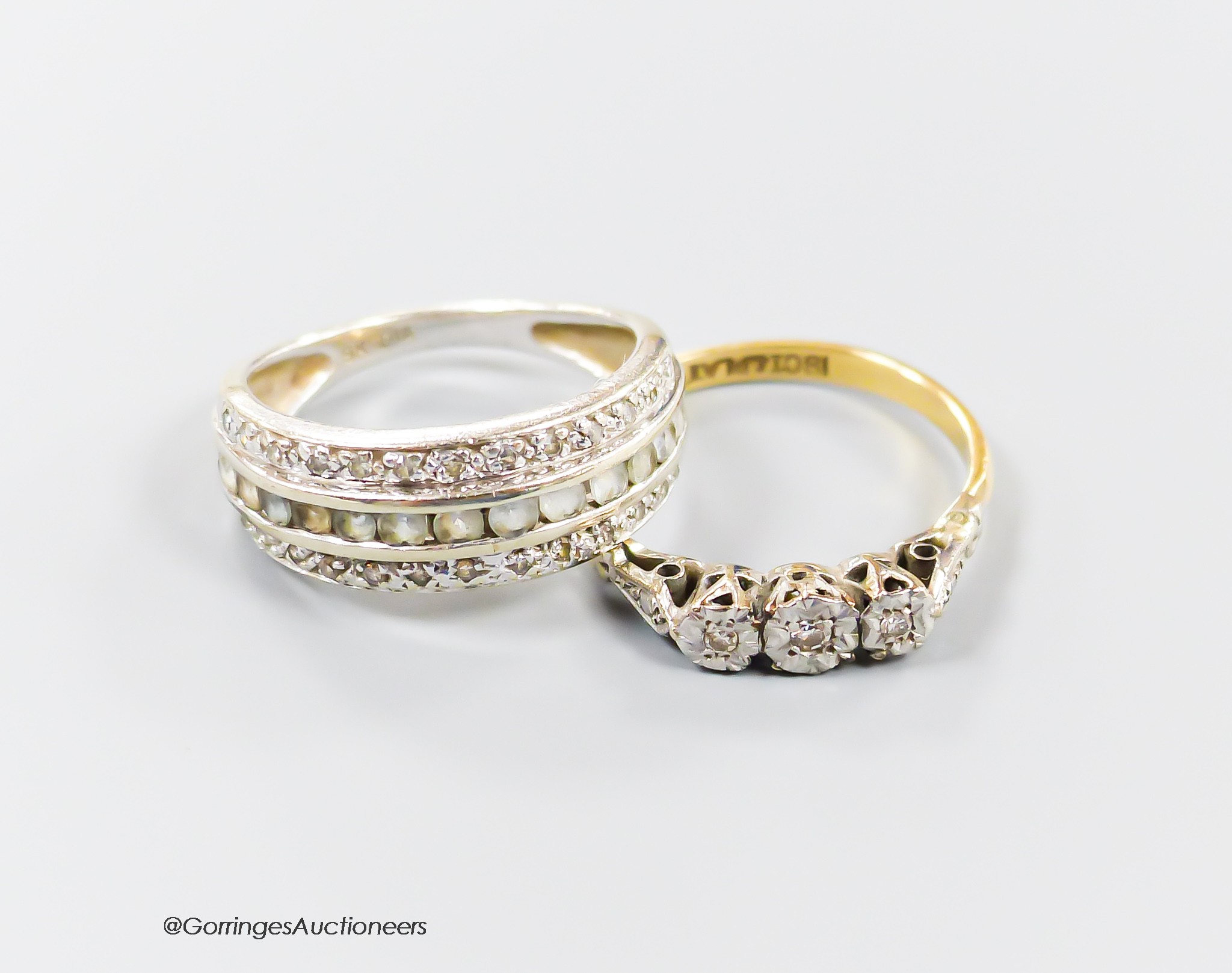 An 18ct & plat, illusion set three stone diamond ring, size M, gross 2.2 grams and a 9ct gem set ring, gross 2.9 grams.